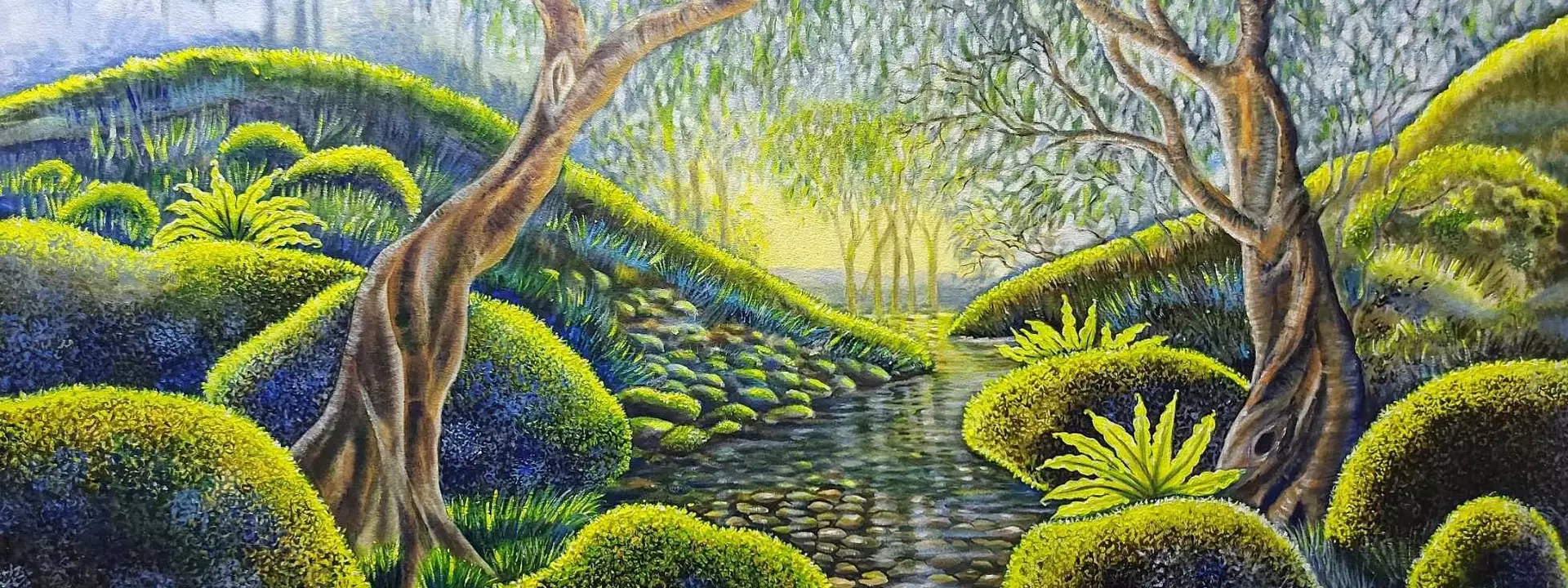 Gently flowing translucent water over rocks surrounded by velvet moss boulders with fluoro highlights.