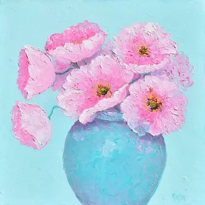 Bright pink poppies in a turquoise blue bowl, contrast with a light blue background.