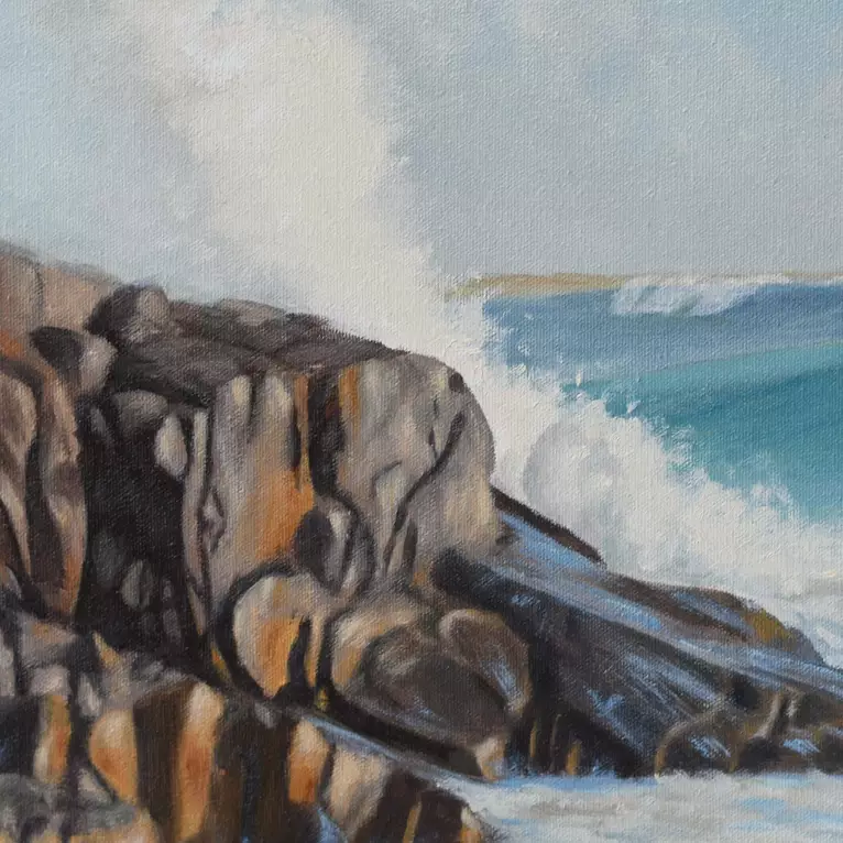 Surf rolling in craching onto rocks gives the power of mother nature — detail