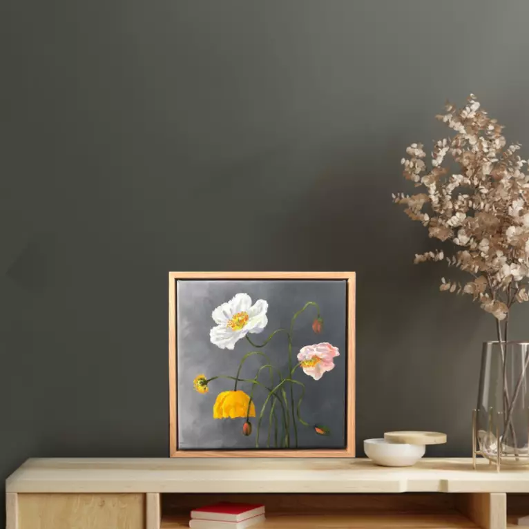 delicate Poppy flowers stems and buds — shown in a room setting