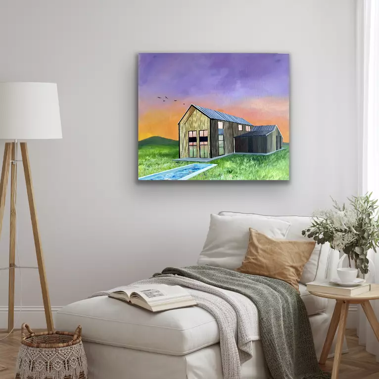 A barn style building set on a field with a pool against a vibrant sky of purple and orange — shown hanging