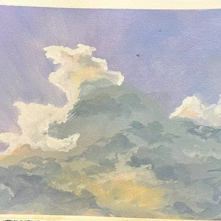 Sunlight coming through clouds, in blue and grey and yellow