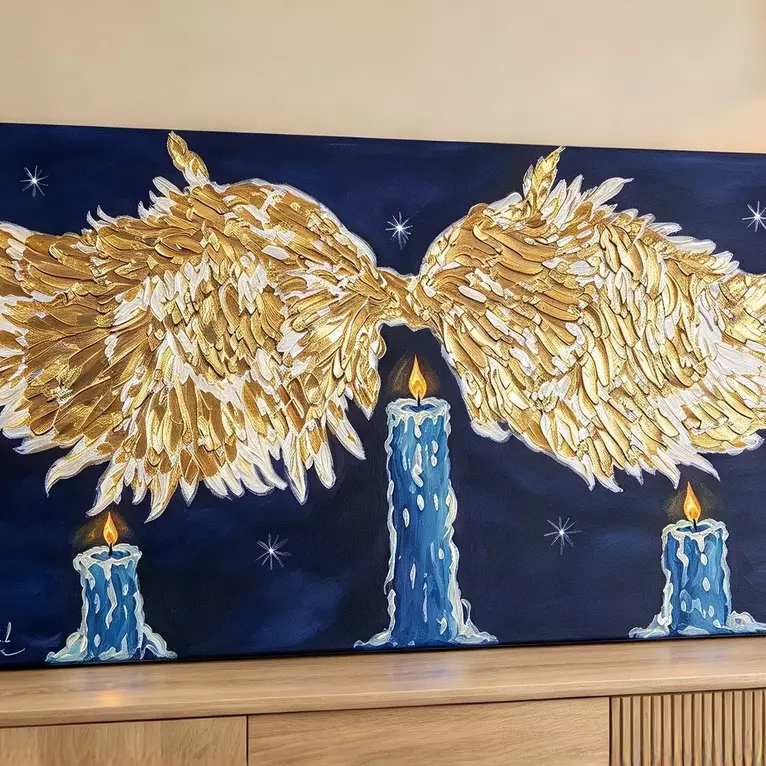 A striking original artwork featuring expansive golden angel wings stretching across a deep midnight-blue sky, with three gl…