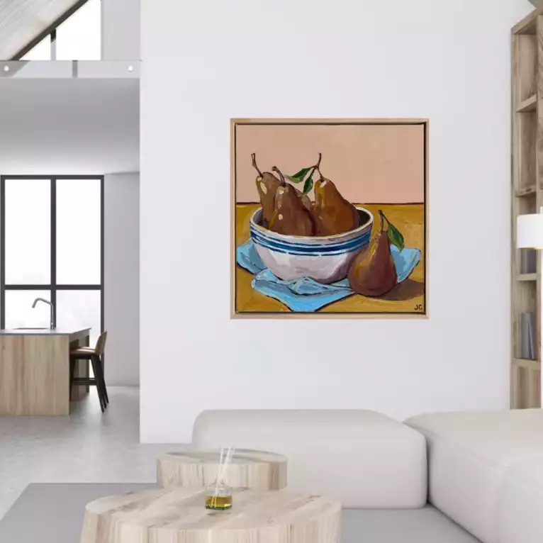 Pears in a bowl on a cloth — shown in a room setting