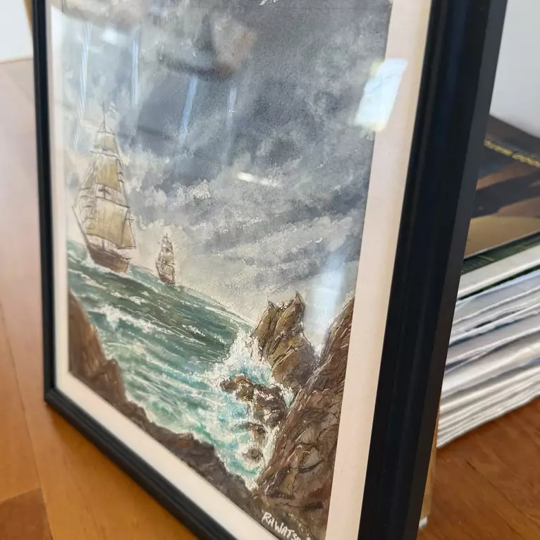 This watercolor painting depicts two traditional tall ships navigating rough, turquoise seas framed by rocky cli… — edge view