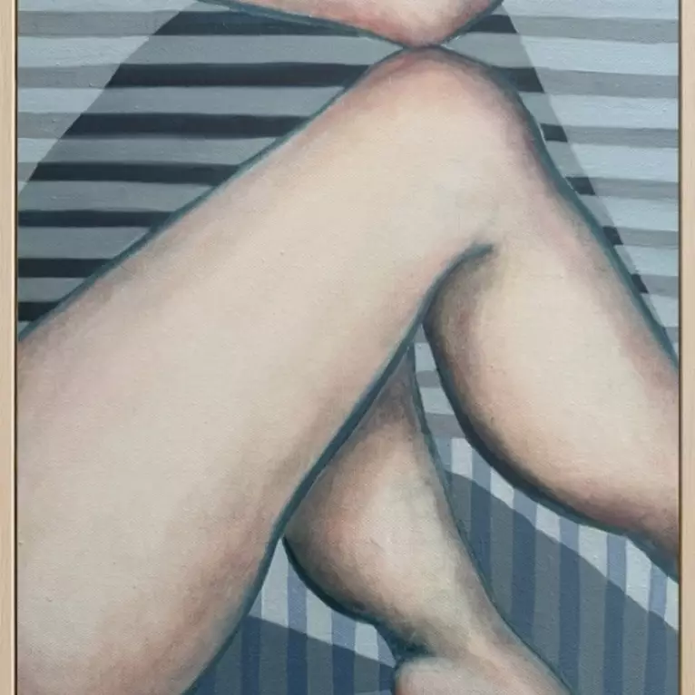 A framed painting of nude legs crossed, one over the other, with soft skin tones. Blue-grey and white horizontal stripes fil…
