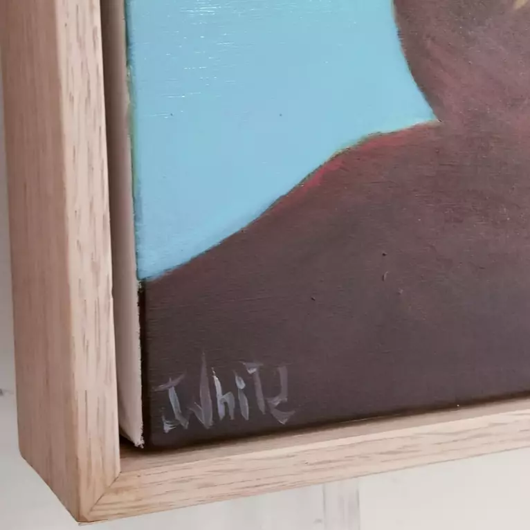 Two young people are silhouetted on a quiet lake Edge. — artist's signature