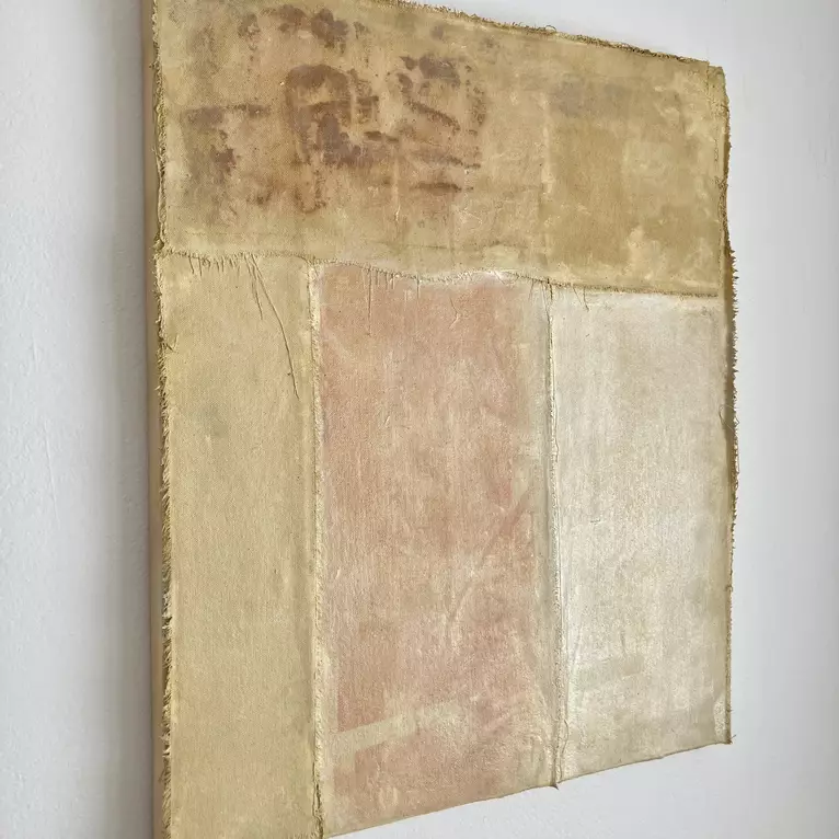 Earthy abstract in yellow ochres and raw edge canvas