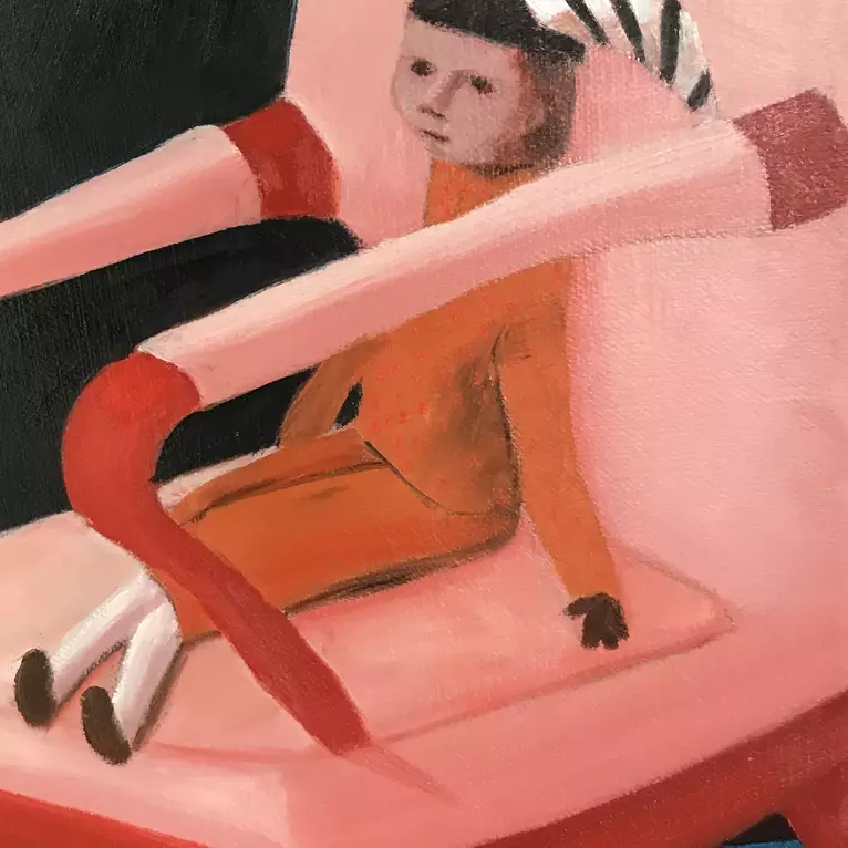 A woman standing in her bedroom next to a lamb and chair with a jester . — detail