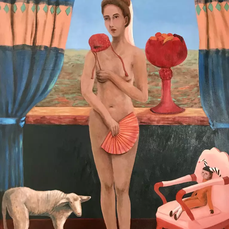 A woman standing in her bedroom next to a lamb and chair with a jester .