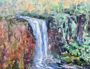 Waterfall cascading down a mountain.