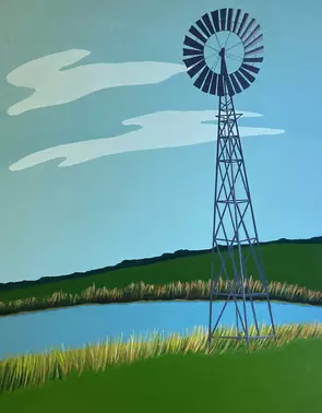 Grey windmill on green pasture, blue dam and sky.