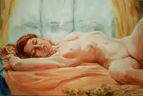 Young lady laying on a peach color blanket at the window.