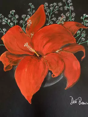 Red hibiscus and baby breath in vase