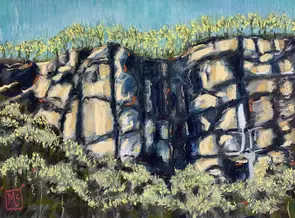 Australian Ancient rock formations with wattle in bloom
