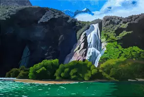 White water cascades down the rocks into the bright green of Milford Sound