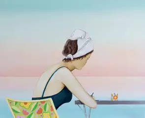 Retro woman writing next to the ocean