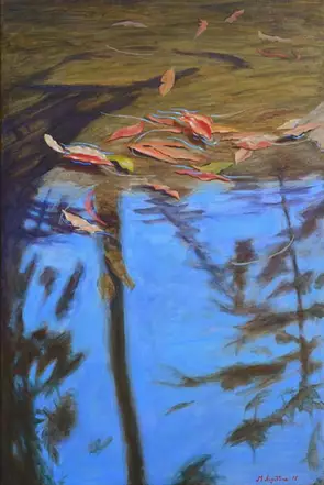 Fallen leaves into the river drifting along can become stuck by the bank