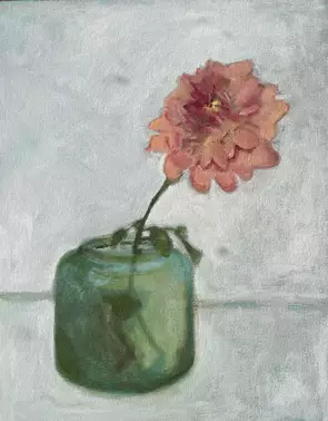 Pink flower in green pot