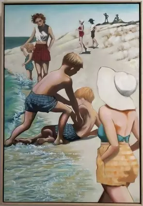 A sand dune with water lapping on one side. Two young boys play together, a young woman in a large white sunhat in the foreg…