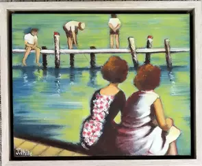 Two young women sit with their backs to the viewer watching fishermen on a wharf in the distance.