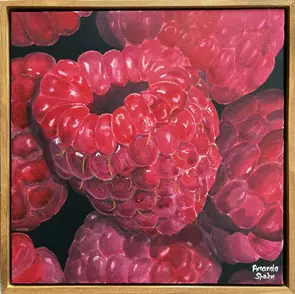 A bunch of raspberries on a black background