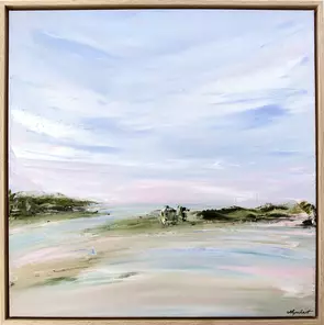 Calm waters meeting shoreline along a pretty coastline