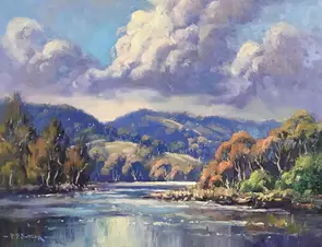 Cumulous clouds reflected in water