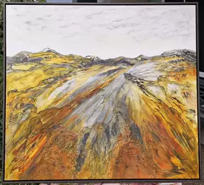 Large, bright, mountainous landscape of Australia. Shades of orange, yellow and grey.