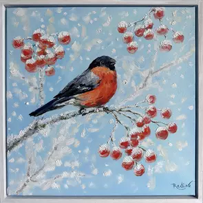 A charming bullfinch perched on a snowy rowan branch, surrounded by bright red berries against a soft winter-blue sky. Rich …