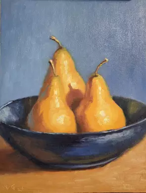 Three ripe golden pears sit in a deep blue ceramic bowl on a warm tabletop. Soft directional light creates luminous yellow a…