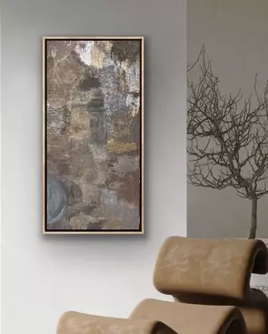 A tall, vertically oriented abstract mixed media painting showcased in a light natural oak floater frame. The composition fe…