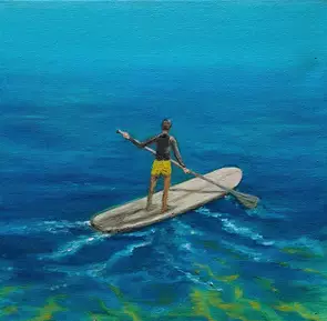 Boy on Paddleboard enjoying the ocean