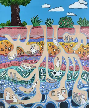 Bunnies in a burrow with layers of earth.