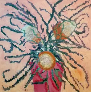 2 banksia flowers in a red vase