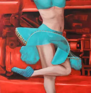 A dancing woman set against the background of a tractor.