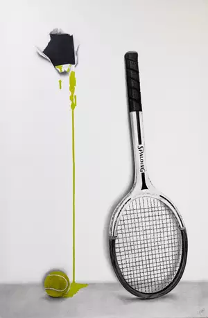 Vintage Spalding tennis racquet leaning against the wall with ripped hole in the canvas and ball on the floor