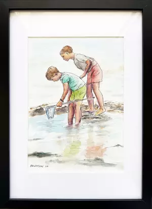 Children use a dip net to discover sea creatures at the beach