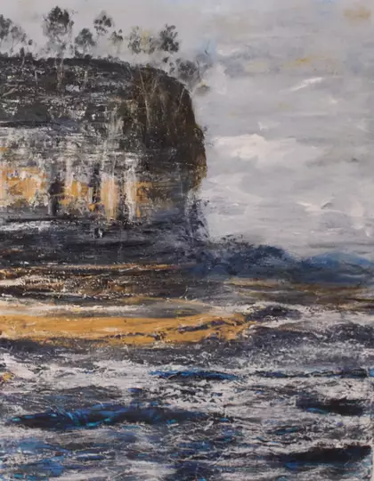 Rugged coastal cliffs rising above a turbulent sea