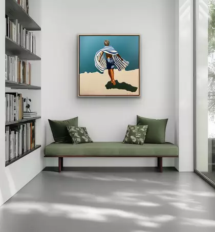Boy on cliff with stripes towel
