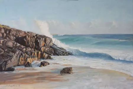 Surf rolling in craching onto rocks gives the power of mother nature