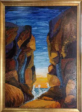 A gap between two cliff faces with a channel in between.
