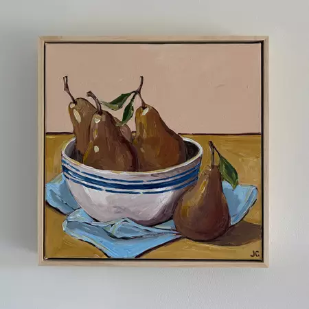 Pears in a bowl on a cloth