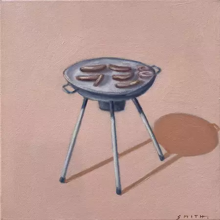 a portable three-legged barbecue on pink background