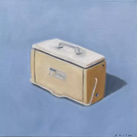 a yellow cooler with shadow on a blue background