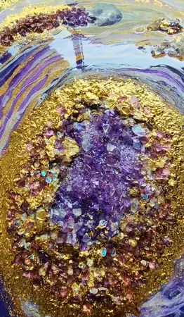 Round geode resin art in purple and gold with crystals, glass and gold foil leaf. — edge view