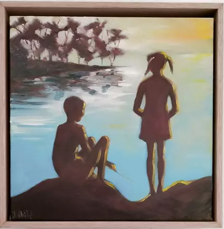 Two young people are silhouetted on a quiet lake Edge.