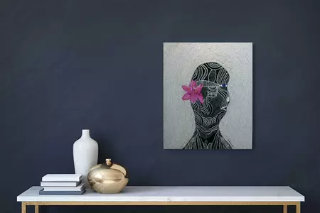 Tribal woman with a pink flower. — shown hanging