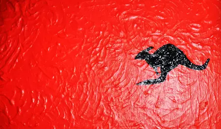 A blend of the Australian Aboriginal and the Papua New Guinea flag colours. — detail